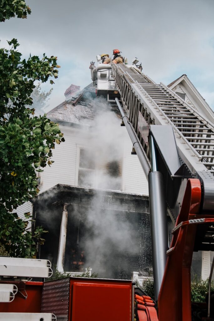 a firetruck with smoke coming out of the back of it